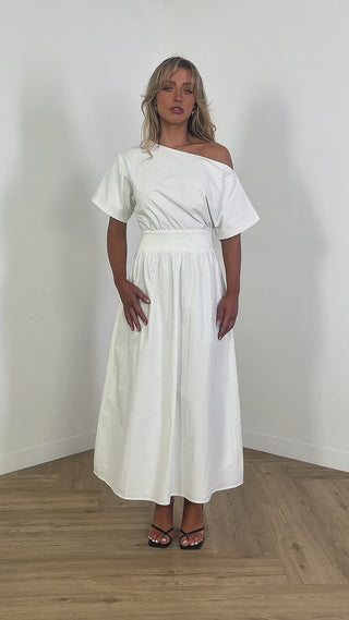 Model wearing white off shoulder midi dress with fitted waist