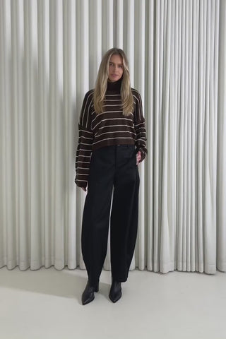 Model showing the Hayes Stripe Knit from the front, side and back to demonstrate its fit and movement.