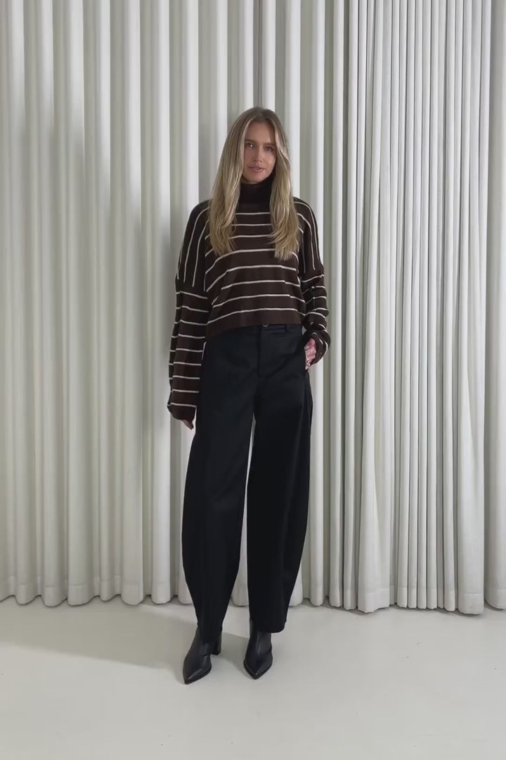 Model showing the Hayes Stripe Knit from the front, side and back to demonstrate its fit and movement.