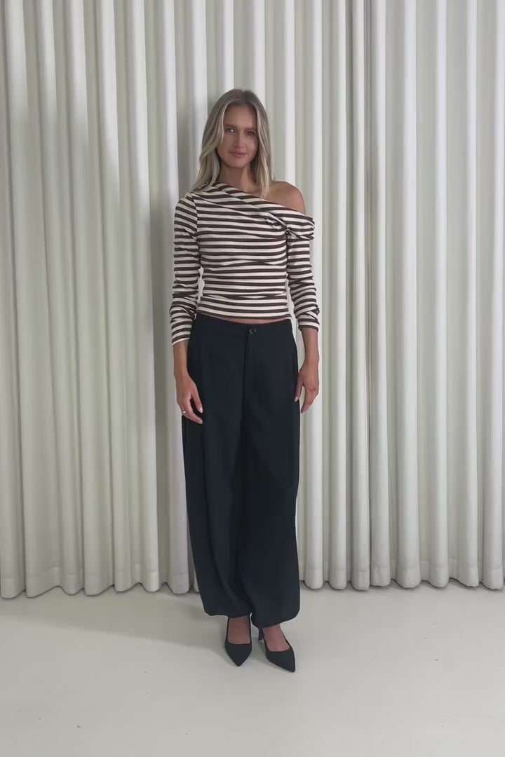 Model showing the Frank Off Shoulder Striped Top from the front, side and back to demonstrate its fit and movement.