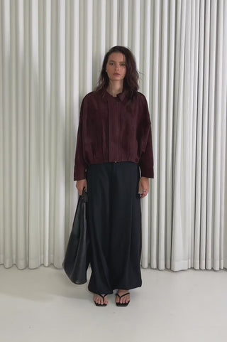 Model showing the Calvin Bomber Jacket from the front, side and back to demonstrate its fit and movement.