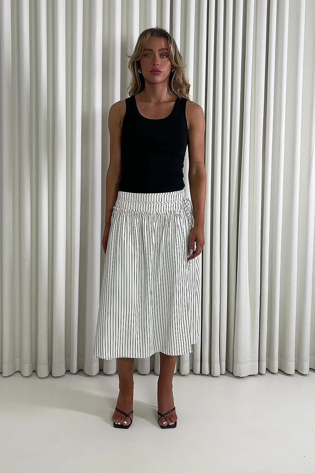 Stripe faux wrap midi skirt with self tie and side zip & Black ribbed longline round neck top with full stretch