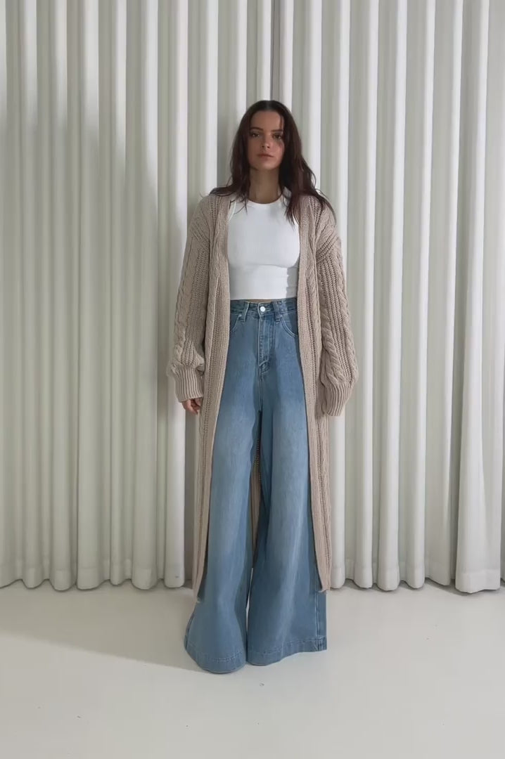 Model showing the Michael Long Cardigan from the front, side and back to demonstrate its fit and movement.