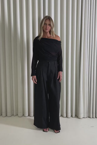 Model showing the Bruce Black Sheer Top and Stuart Black Pants from the front, side and back to demonstrate its fit and movement.