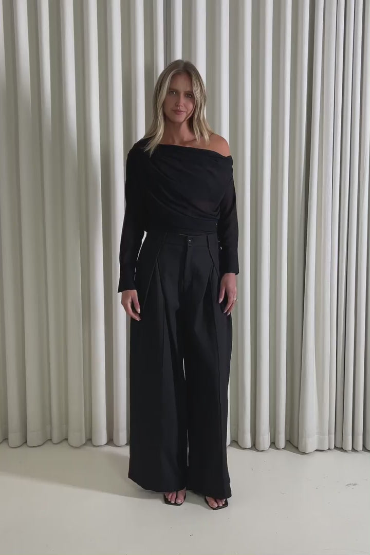 Model showing the Bruce Black Sheer Top and Stuart Black Pants from the front, side and back to demonstrate its fit and movement.