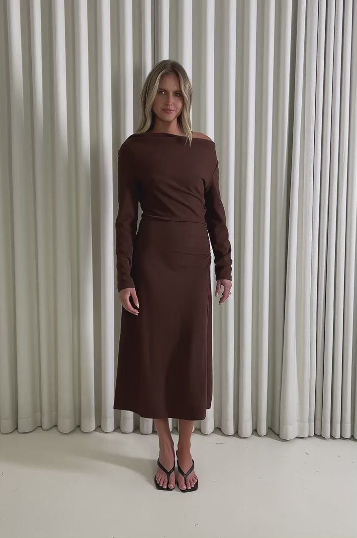 Model showing the Isabelle Brown Midi Dress from the front, side and back to demonstrate its fit and movement.
