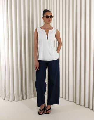 White linen-cotton sleeveless top with V neck, tailored waist and peplum
