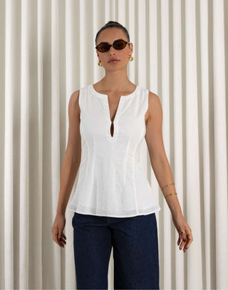 White linen-cotton sleeveless top with V neck, tailored waist and peplum