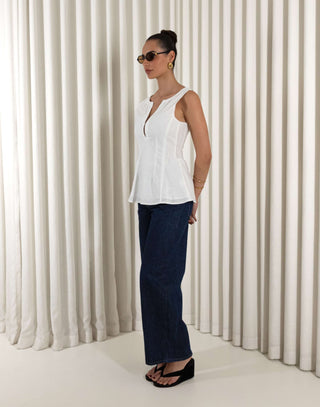 White linen-cotton sleeveless top with V neck, tailored waist and peplum