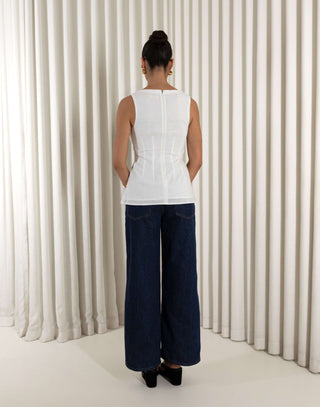 White linen-cotton sleeveless top with V neck, tailored waist and peplum