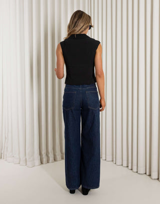 Black sleeveless collared top with two way gold zip and darts