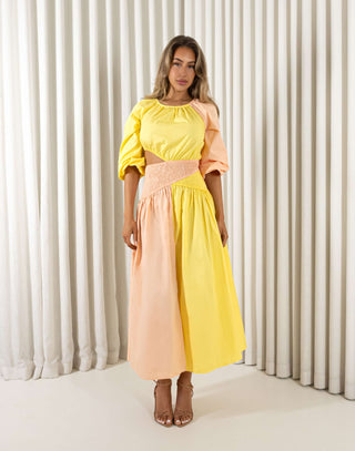 Yellow cotton midi dress with round neck, shirred waist and side cut outs