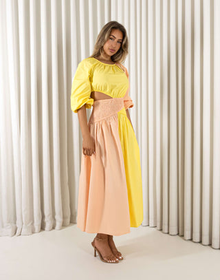 Yellow cotton midi dress with round neck, shirred waist and side cut outs