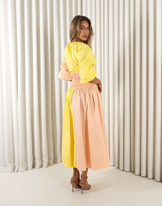 Yellow cotton midi dress with round neck, shirred waist and side cut outs
